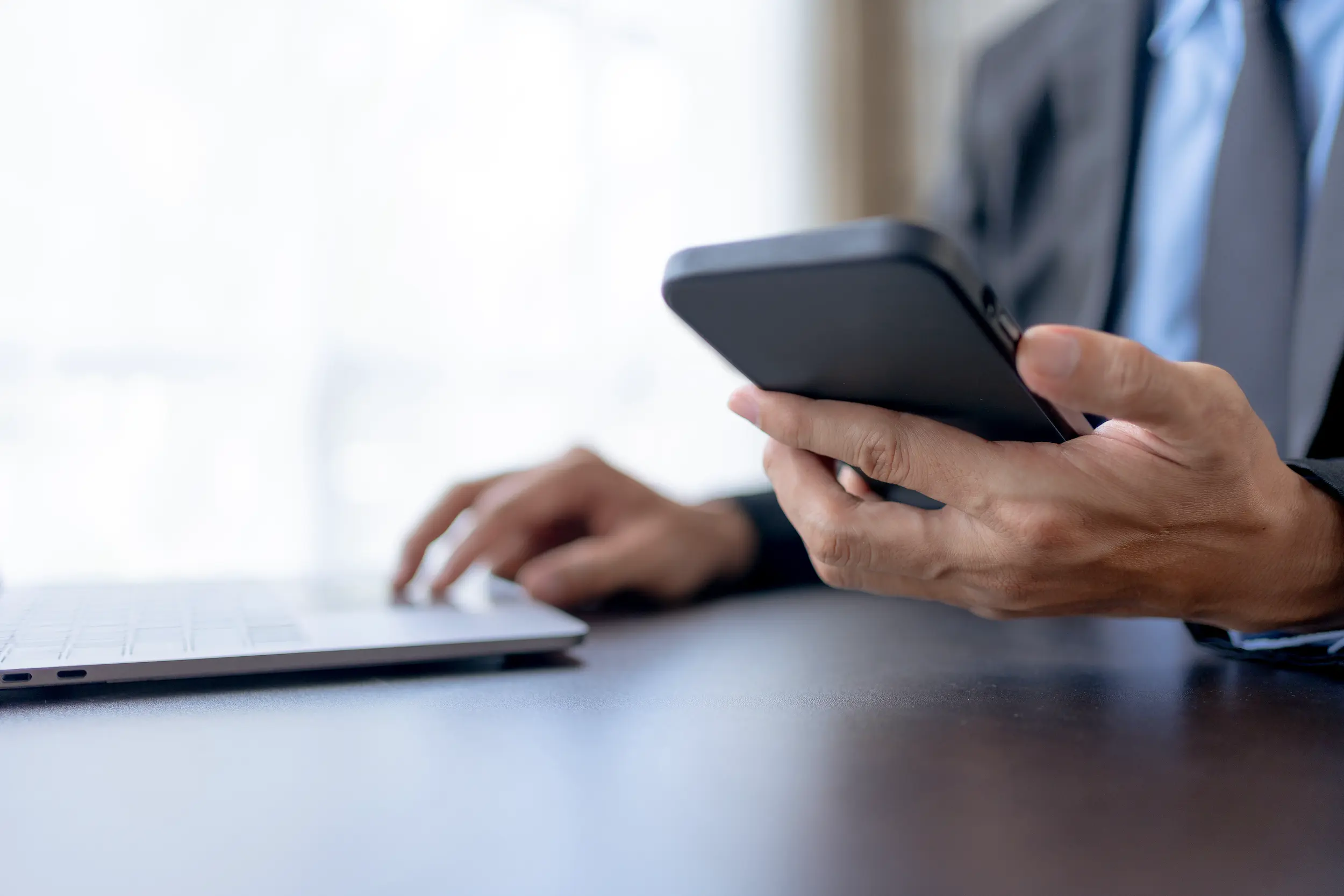 businessman using smartphone to send text messages 2026 01 08 22 12 57 utc