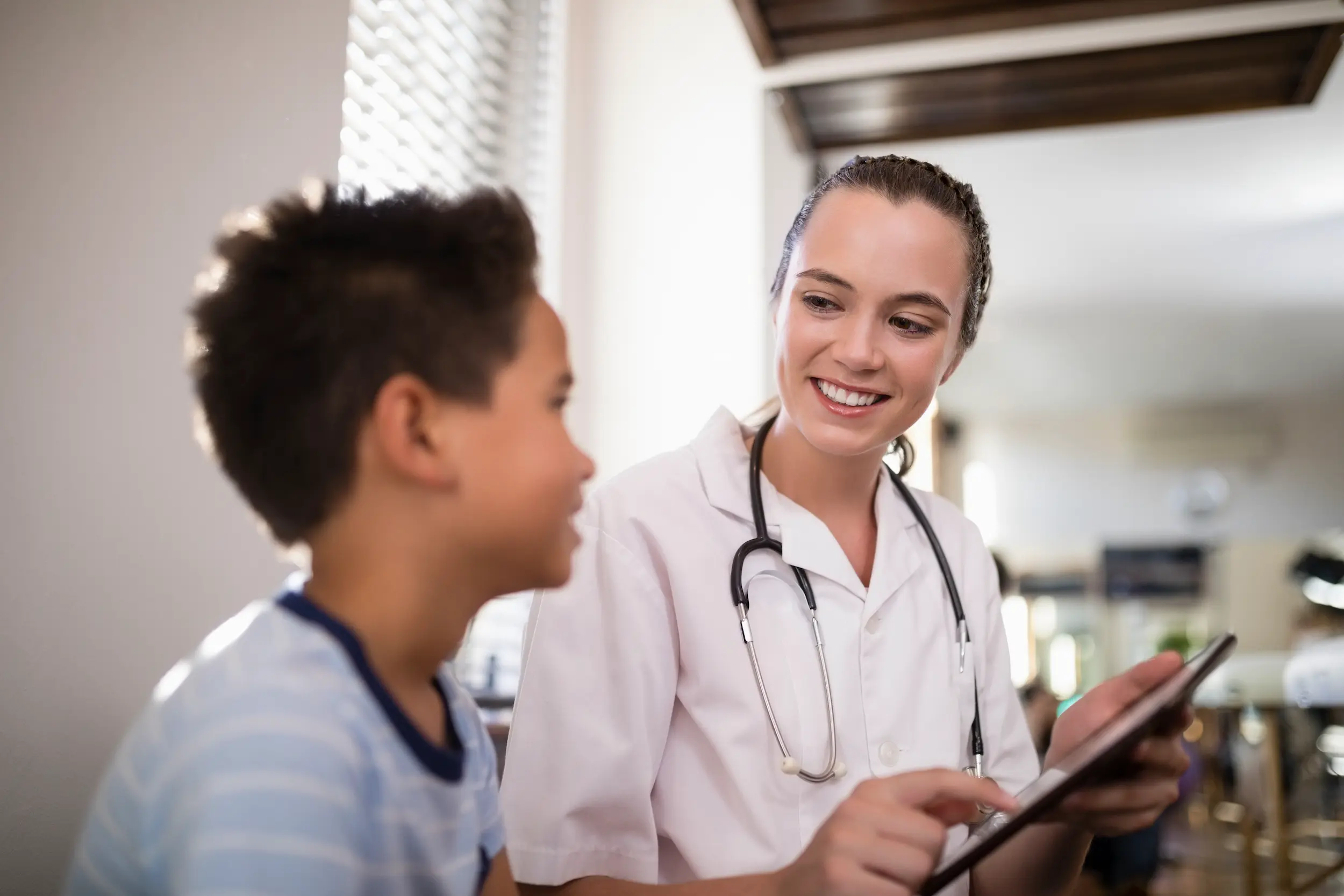 doctor using tablet with child during examination 2026 03 25 00 49 54 utc